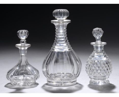 A MINIATURE  CUT GLASS DECANTER AND STOPPER  AND TWO MINIATURE CUT GLASS DECANTERS AND STOPPERS, ALL EARLY 19TH C 10, 10.5 an