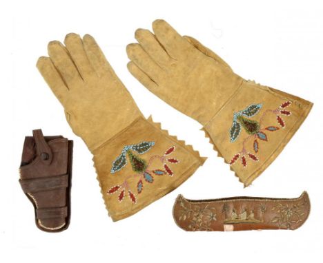 A PAIR OF NATIVE AMERICAN SUEDE GAUNTLETS WITH BEADWORK DECORATION, A MINIATURE BARK AND EMBROIDERED CANOE AND A LEATHER HOLS