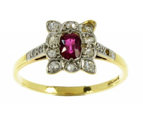 A RUBY AND DIAMOND CLUSTER RING  gold hoop marked 18ct and Pt, 2.5g, size O++Lacking one diamond from one of the shoulders, a