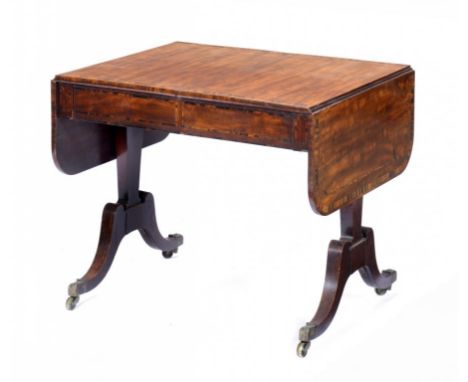 A REGENCY MAHOGANY AND CALAMANDER SOFA TABLE, C1820   the drop leaf top fitted with two drawers, on tapered trestles with hig