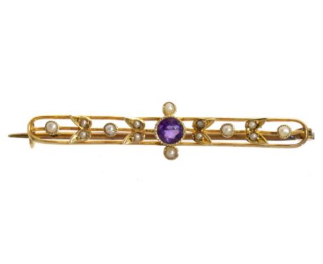 AN AQUAMARINE AND SPLIT PEARL BROOCH AND AN AMETHYST AND SPLIT PEARL BROOCH, BOTH C1910 in gold, 47 and 43mm, the first marke