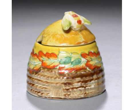 CLARICE CLIFF.  AN A J WILKINSON HONEY POT AND COVER, C1934  painted with a version of Acorns, 7cm h, printed mark++In good c