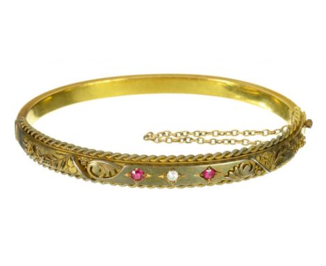 A VICTORIAN RUBY AND DIAMOND SET 15CT GOLD BANGLE  61mm, by W G Myers, Birmingham 1895, 10.7g++Several minor light scratches 