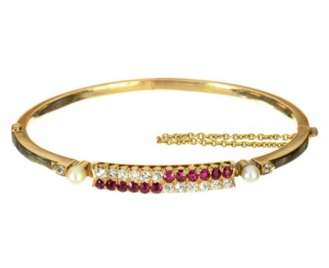 A RUBY AND DIAMOND BRACELET, EARLY 20TH C  of double crossover design set with twelve rubies and twelve diamonds between sing