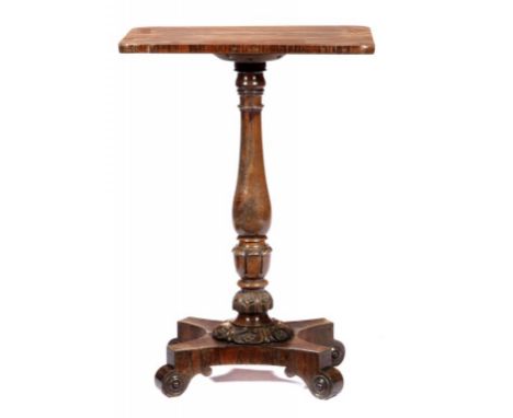 A REGENCY GONCALO ALVES PEDESTAL TABLE, C1830  with leaf carved knop, platform and scroll feet, brass castors, 75cm h, 75cm s