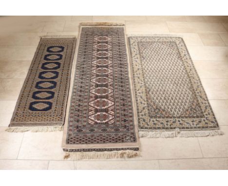 Three Persian tokens.&nbsp;(1) Token, blue/pink in color with seven medallions, size: 140 x 47 cm.&nbsp;(2) Runner, light bro