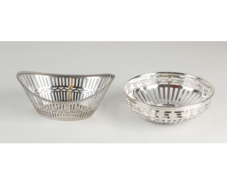 Two silver bonbon baskets, an oval model, 833/000, with sawn bar decor and a pearl rim, with engraving on the bottom: W.&amp;
