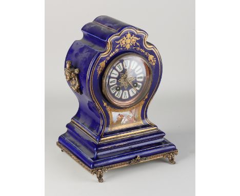 Antique French porcelain mantel clock.&nbsp;Unclearly marked.&nbsp;Circa 1890. Eight-day movement, half-hourly strike, spring