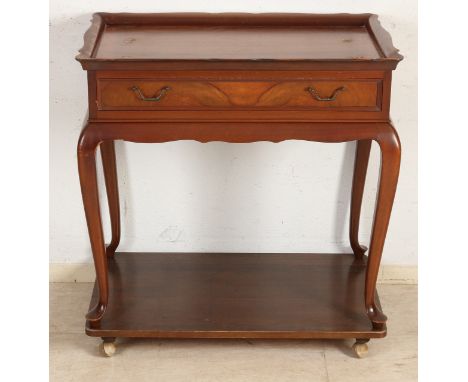 Mahogany tea table with drawer, shelf and wheels.&nbsp;Second half of the 20th century.&nbsp;Dimensions: 81 x 77 x 47 cm.&nbs