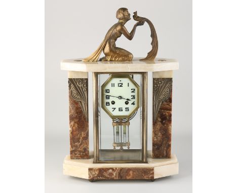 French Art Deco glass mantel clock.&nbsp;Marble with onyx.&nbsp;Circa 1920. Figure with bird of paradise.&nbsp;Break in onyx.