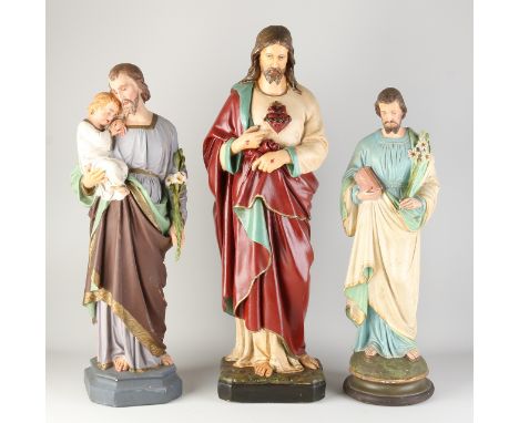 Three antique holy statues.&nbsp;First half 20th century.&nbsp;Plaster + polychromy.&nbsp;Some chips.&nbsp;Dimensions: 54 - 6