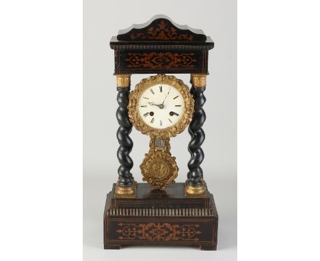 Antique French Louis Philippe column mantel clock with intarsia and gilt brass capitals.&nbsp;Eight-day movement, half-hourly