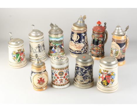 Ten old German ceramic beer mugs with tin lid.&nbsp;20th century.&nbsp;Dimensions: 17 - 28 cm.&nbsp;In good condition.