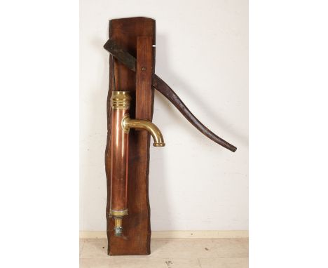 Large antique copper water pump on oak shelf.&nbsp;Dimensions: H 167 cm.&nbsp;In good condition.