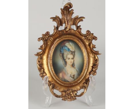 Signed.&nbsp;Circa 1900. Miniature female portrait in beautiful wood-carved frame.&nbsp;Oil on panel partly painted.&nbsp;Dim