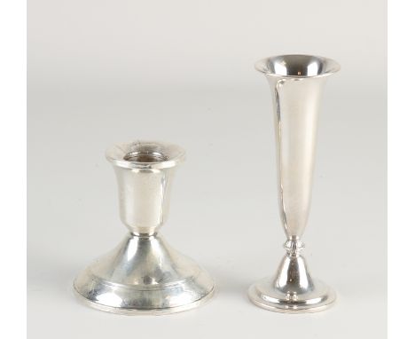 Silver candlestick and vase.&nbsp;Small vase, 835/000, on a round foot with turned-up rim.&nbsp;ø4x12.5cm.&nbsp;And a table c