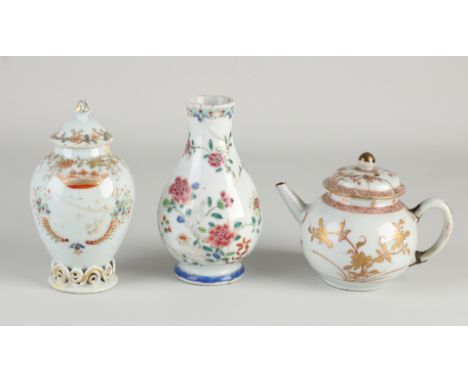 Three parts 18th century Chinese porcelain.&nbsp;Consisting of: tea pot, tea caddy + vase.&nbsp;Family Rose.&nbsp;damaged.&nb