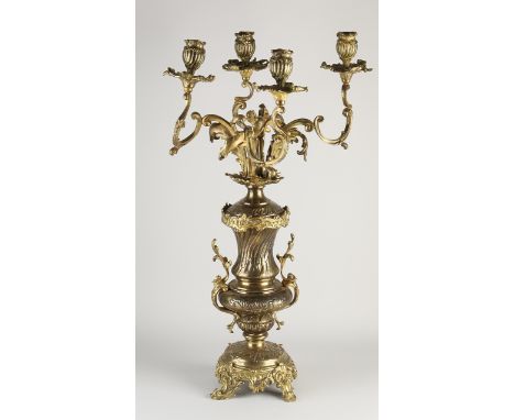 Large 19th century neo-rococo gilt brass four-armed candlestick.&nbsp;Dimensions: H 66 cm.&nbsp;In good condition.