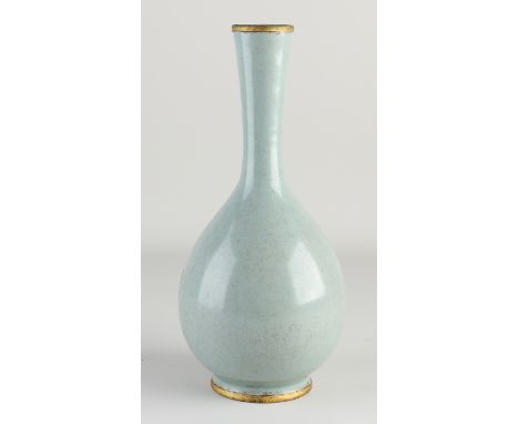 Chinese porcelain vase with light green glaze, text and gold rim.&nbsp;Dimensions: H 28 cm.&nbsp;In good condition.