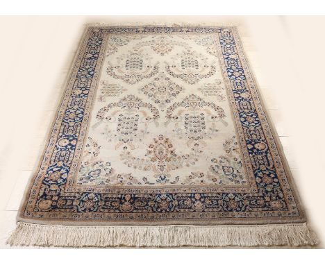 Large hand-knotted carpet.&nbsp;Guldasta India.&nbsp;Light in color with floral arrangement.&nbsp;Dimensions: 248 x 163 cm.&n