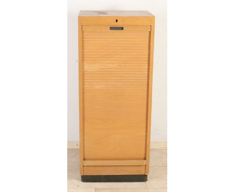 1950s plywood filing cabinet with roller shutter.&nbsp;Dimensions: 106 x 44 x 35 cm.&nbsp;In good condition.