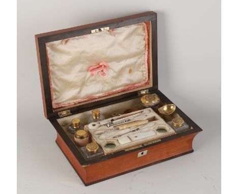 19th century mahogany lidded box with travel accessories.&nbsp;Partly complete.&nbsp;With mother-of-pearl, brass and gold pla