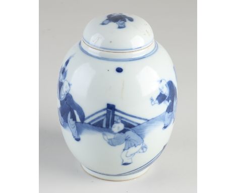 Chinese porcelain tea caddy with playing fools in a garden decor.&nbsp;Six characters bottom mark.&nbsp;Dimensions: H 13.5 cm