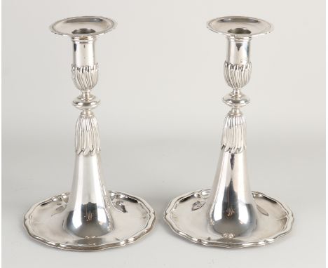 Set of special silver trumpet candlesticks, Switzerland 1765, on a large round, contoured silver base with ribs and a column 