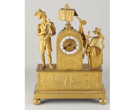 Large French fire-gilt bronze Empire mantel clock.&nbsp;Circa 1820. Man with lyra and armor with shield.&nbsp;Eight-day movem