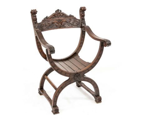 Oak Dagobert chair.&nbsp;With sculpture typical of that time.&nbsp;Circa 1880. Dimensions: 85 x 58 x 52 cm.&nbsp;In good cond