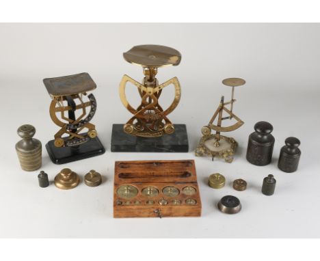 Three antique postal scales + weight set.&nbsp;Dimensions: 16 - 22 cm.&nbsp;In good condition.