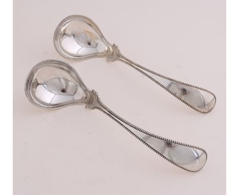 Pair of beautiful egg spoons, 833/000, with pearl rim.&nbsp;17 cm.&nbsp;in total about 93 grams.&nbsp;MT.: AFvan Wijk, Amster
