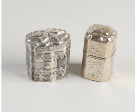 Two silver loderein boxes, 833/000, a rectangular contoured model decorated with various bindings and hinged lid, tear in and