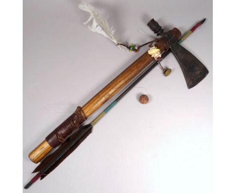 A native American tomahawk/peace pipe - the iron blade on a hickory shaft with shell and feather decoration, length 49cm, tog