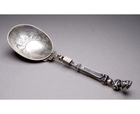 A Dutch silver travelling spoon/fork - the bowl engraved with foliage and detaches from folding fork which features a figural