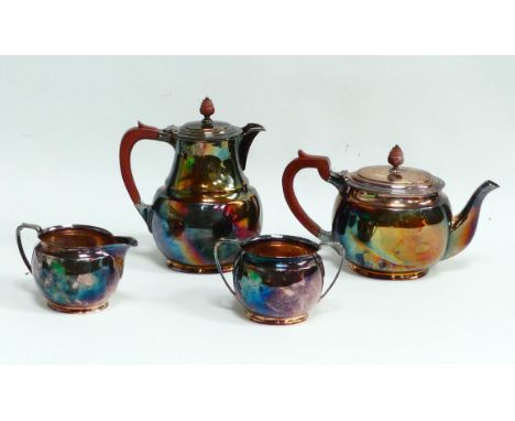 A silver plated five piece tea service - comprising teapot, hot water jug, sucrier, milk jug and circular ogee shaped tray (5