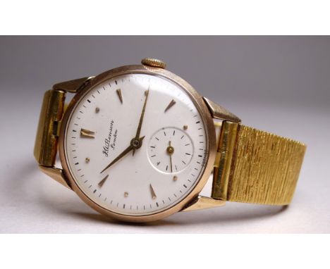 A 9ct gold watch by J W Benson, London - the white dial with an arrangement of dagger and dot numerals and a subsidiary secon