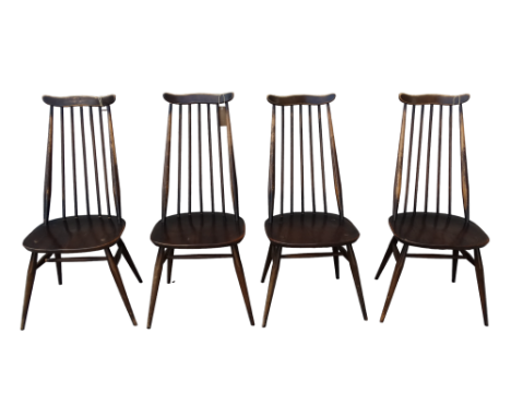 A set of four Ercol beech and elm 'Goldsmiths' dining chairs - dark stained with shaped rail back and spindles above saddle s