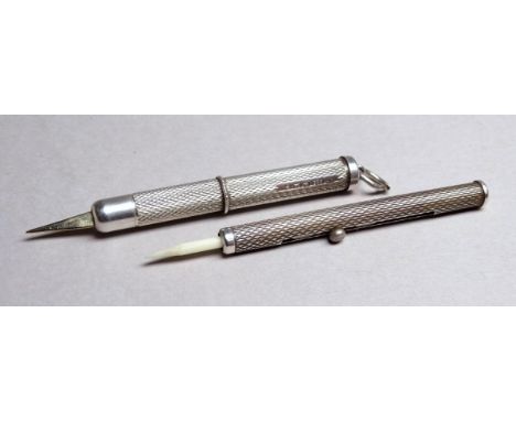 A silver tooth pick - Birmingham 2004, engine turned with a glided pick, together with another example (2)
