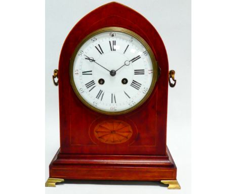 A late 19th century mahogany mantel clock - the lancet case with inlay, twin drop handles and raised on brass bracket feet, t