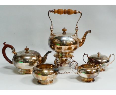 A five piece silver tea service - London 1925, Crichton Brothers (Lionel Alfred Crichton), comprising a kettle with burner an