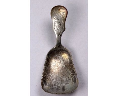 An early 20th century white metal Dutch caddy spoon - bearing purity marks, with a foliate engraved handle, weight 13.2g.