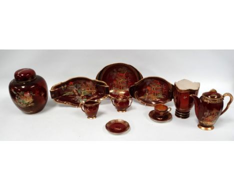 Carlton Ware Rouge Royale - a ginger jar decorated with landscape scenes, height 21cm, together with three serving plates, a 