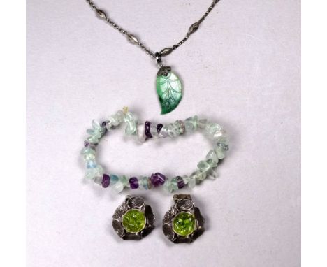 A jade pendant - modelled in the form of a leaf on a base metal chain interpersed with husks, together with a hardstone brace