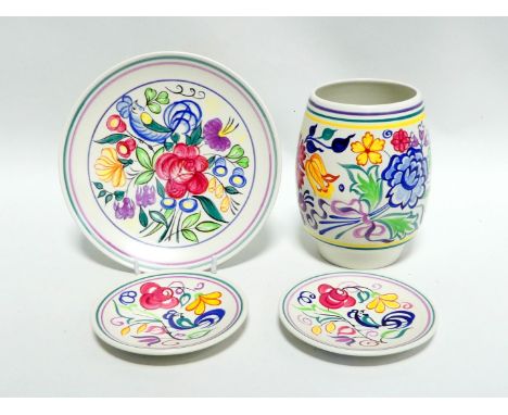 A Poole Pottery vase - polychrome decorated with summer flowers, height 16cm, together with three Poole Pottery plates with s