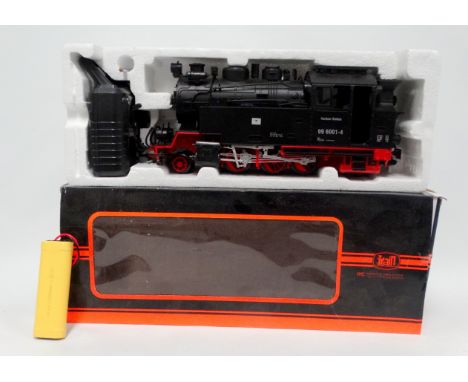 A radio controlled G scale garden locomotive - 45mm gauge, including a tank engine in black livery, together with four flat-b