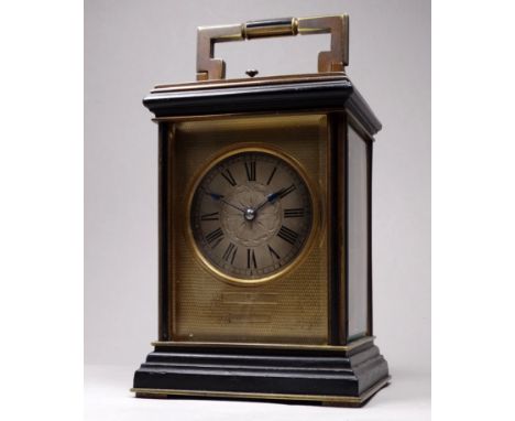 An early 20th century quarter repeating brass carriage clock - the corniche case with bevelled plates, the silvered dial engr
