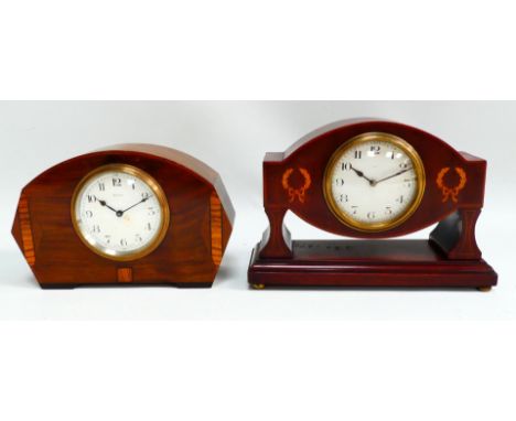 An Edwardian mahogany case mantel clock - the case with wreath inlay, the silvered dial set out in Arabic numerals, height 17