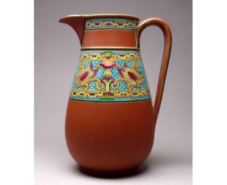 Christopher DRESSER for Watcombe Pottery - a small terracotta jug decorated with an enamel band depicting hippocamps on a sca