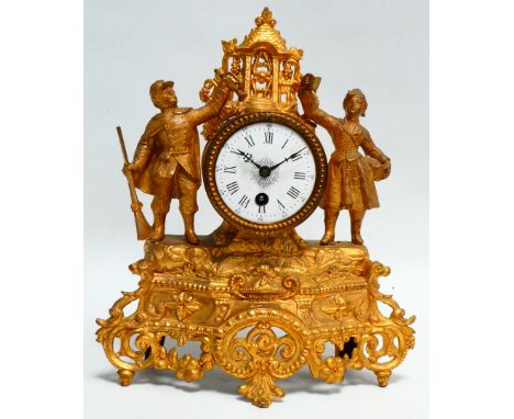 A late 19th century spelter mantel timepiece - gilt painted and modelled with two figures, the white enamel dial set out with
